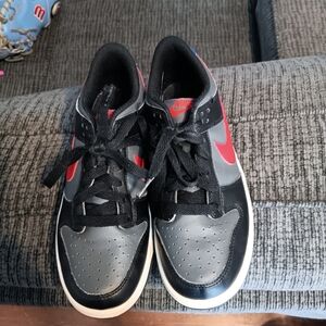 Nike Kids Black and Gray Sneakers with Red Accents